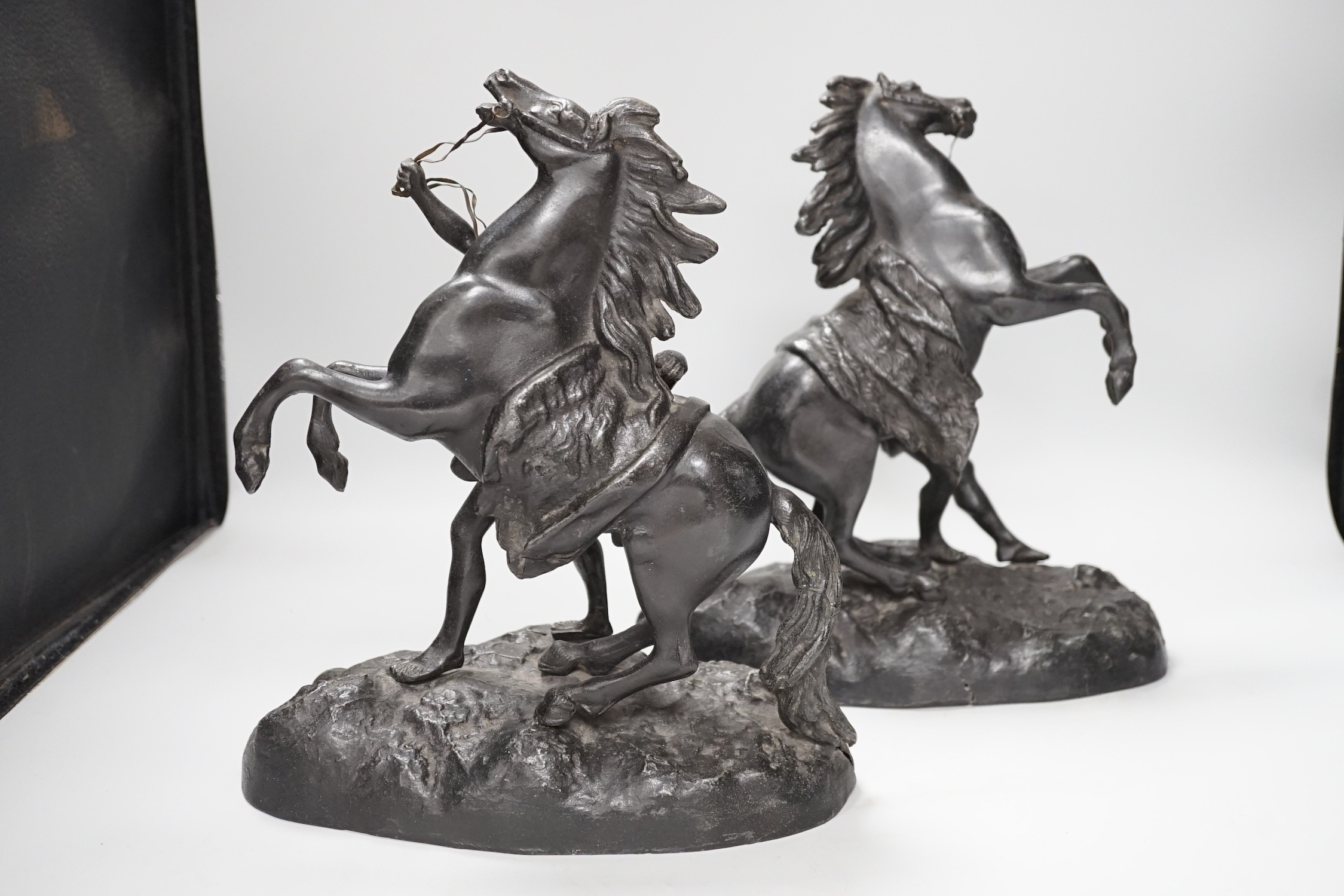 A pair of spelter Marley horses, 31cm